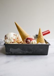 Strawberry Shortcake Ice Cream Strawberry Shortcake Ice Cream by Wood and Spoon. This is a no-churn ice cream with a strawberry sauce and bits of cake throughout. The no churn base has a bit of cream cheese to enhance the flavor and the strawberry sauce is a quick stovetop drizzle with a jam consistency. Learn more about the how to make ice cream at home without an ice cream machine and what to use leftover cake scraps for with this recipe on thewoodandspoon.com by Kate Wood
